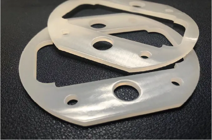  High-precision custom-cut rubber gaskets processed by ZINGCUT CNC cutting machine, showing clean, burr-free edges and precise cutouts