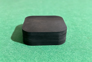 Rounded square rubber sheet sample on green cutting mat, precision cut by ZINGCUT digital cutter