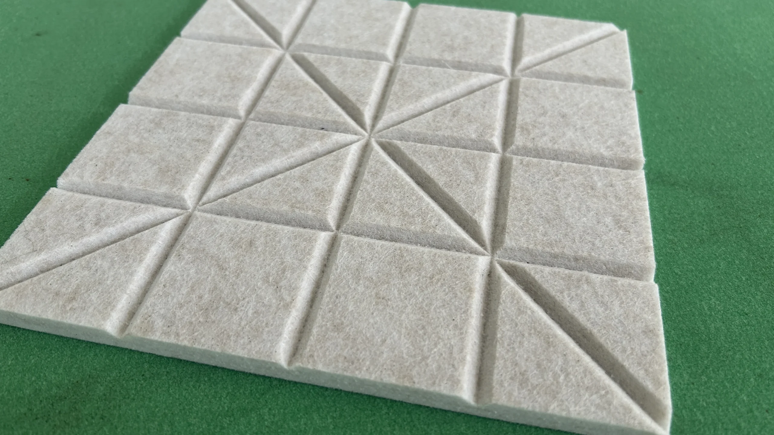 Grooved sound-absorbing panel sample cut by ZINGCUT digital cutting machine, acoustic panel material