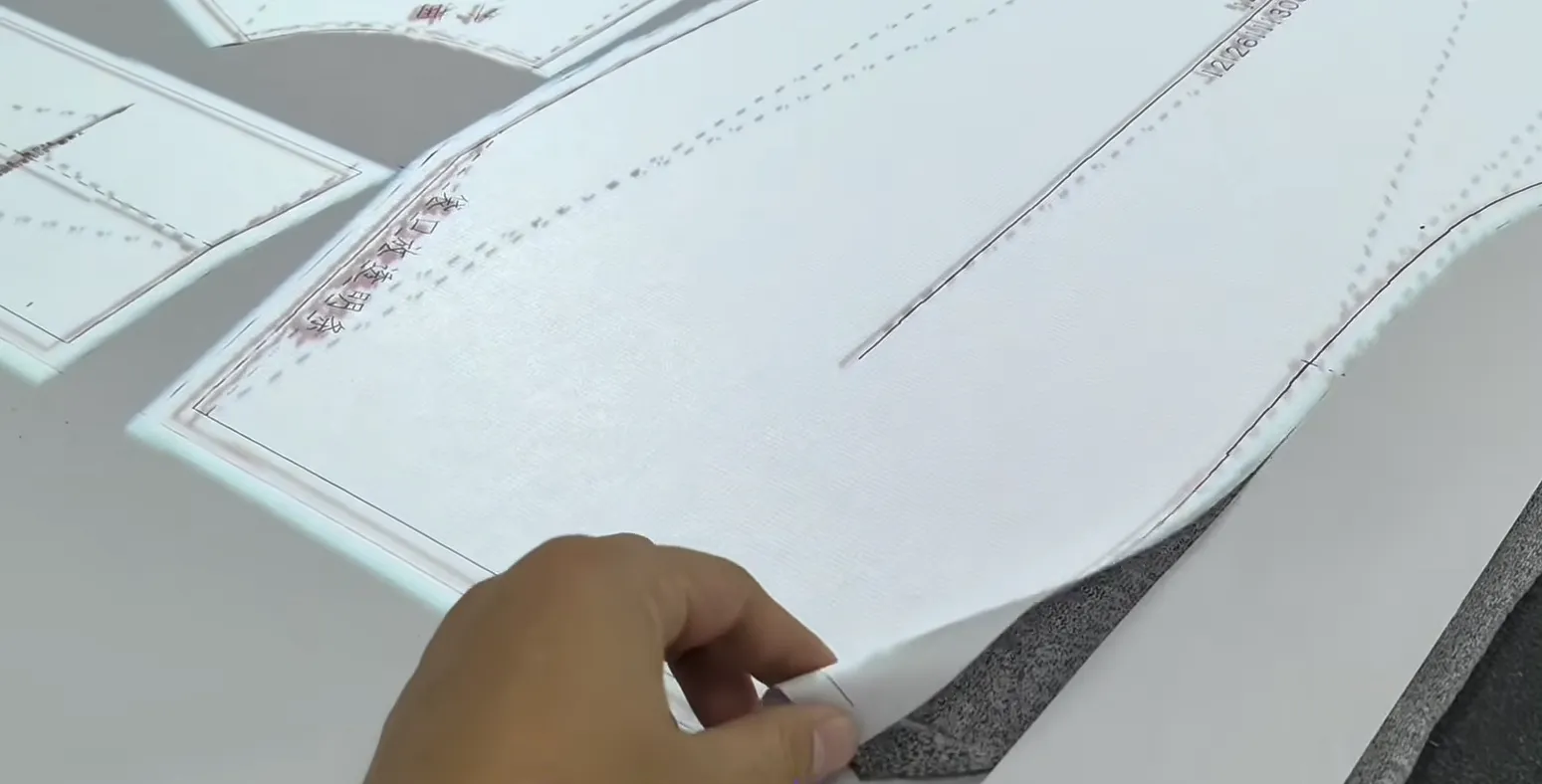 Step 09 Collection, operator collects finished cut parts after digital cutter cutting process 
